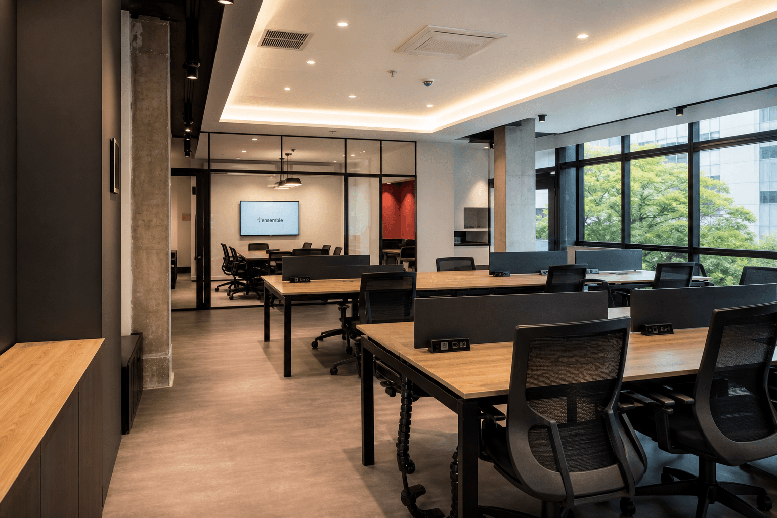 Modern SME office fit-out with desks, glass meeting room, and polished finishes in Singapore